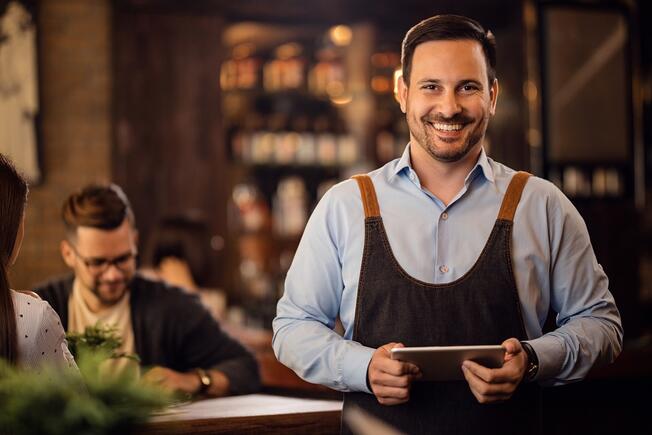 Waiter smiling